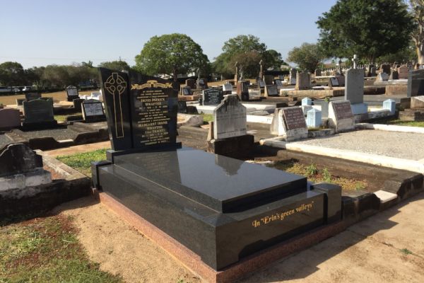 Australian Imperial Black custom headstone, kerbs, veneers, columns, ledger, with a gold incised inscription and photo etchings.
