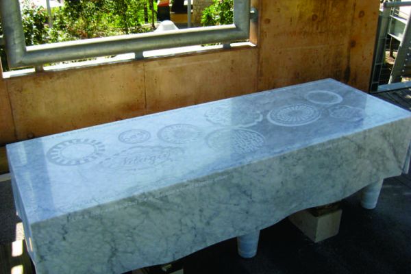 Confluenza finished artwork with etched circular plate designs.
