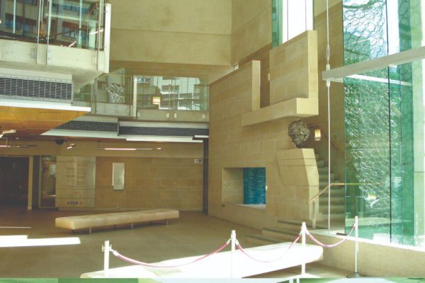 This is the complete installation in situ showing the bust and the wall in the building's foyer.
