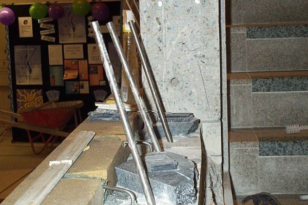 Site of bronze bust installation showing the process of pinning base courses.