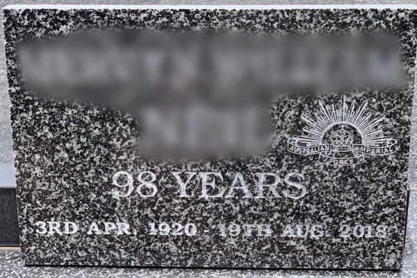 Lawn plaque - Australian Grandee granite with a natural incised inscription