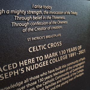 A bronze plaque with a beautiful example of memorial plaque wording.