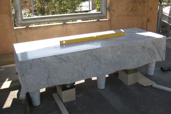 The marble table in it's final position and making final adjustments.