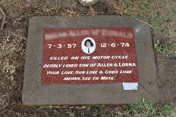 This lawn plaque features Australian Calca granite, embedded in a concrete chamfered surround, finished with a white incised inscription and a porcelain photo.