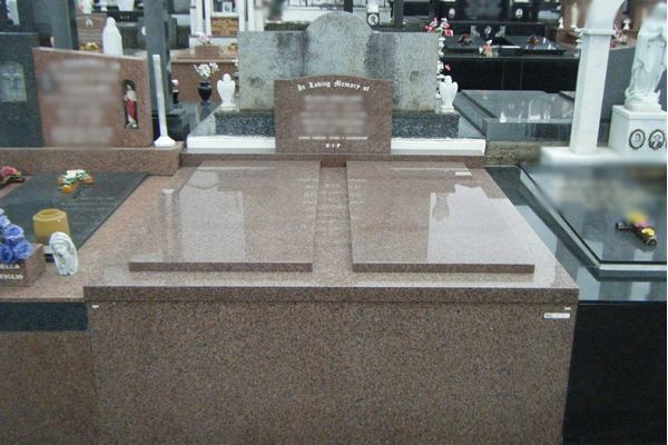 Grave granite cover and veneer to all sides.