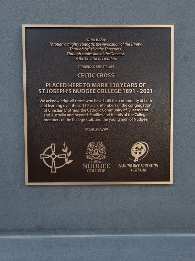 Raised inscription on the bronze plaque of the completed Celtic Cross at Nudgee College.