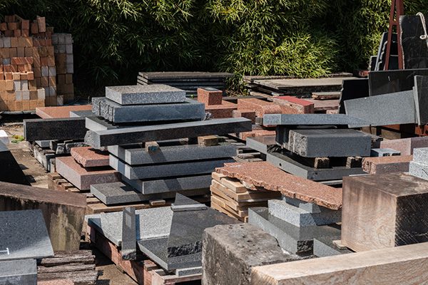 Australian Imperial Granite and other types of stone awaiting processing at the T. Wrafter & Sons factory.