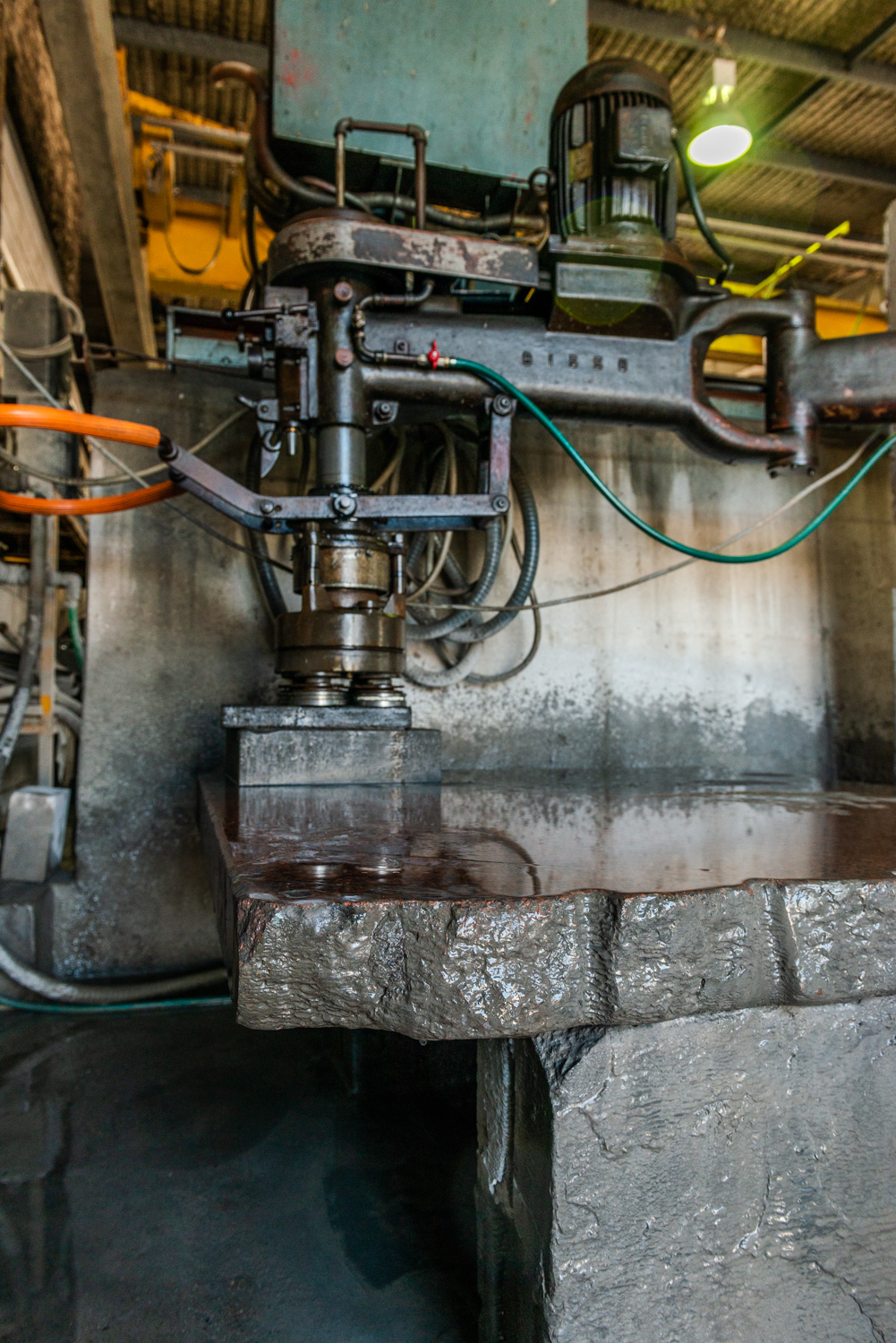 Using water to reduce dangerous dust particles in the T. Wrafter & Sons Stonemasonry factory.